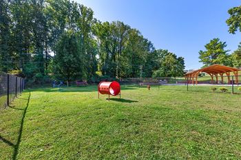 A park with a playground and a swing set
